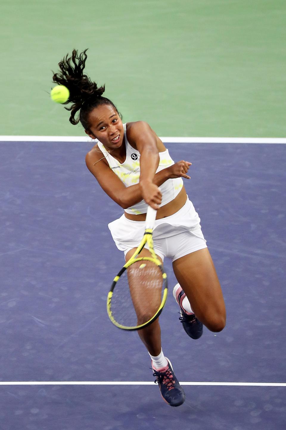 Leylah Fernandez of Canada hits a return to Paula Badosa of Spain during the BNP Paribas Open in Indian Wells, Calif., on Tuesday, March 15, 2022.