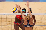 <p>Leila Consuelo Martinez Ortega #2 of Team Cuba hits past Alix Klineman #2 of Team United States during the Women's Round of 16 beach volleyball on day ten of the Tokyo 2020 Olympic Games at Shiokaze Park on August 02, 2021 in Tokyo, Japan. (Photo by Clive Brunskill/Getty Images)</p> 