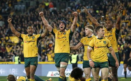 Members of Australia's Wallabies rugby team celebrate their Bledisloe Cup win over New Zealand's All Blacks in Sydney, August 8, 2015. REUTERS/David Gray