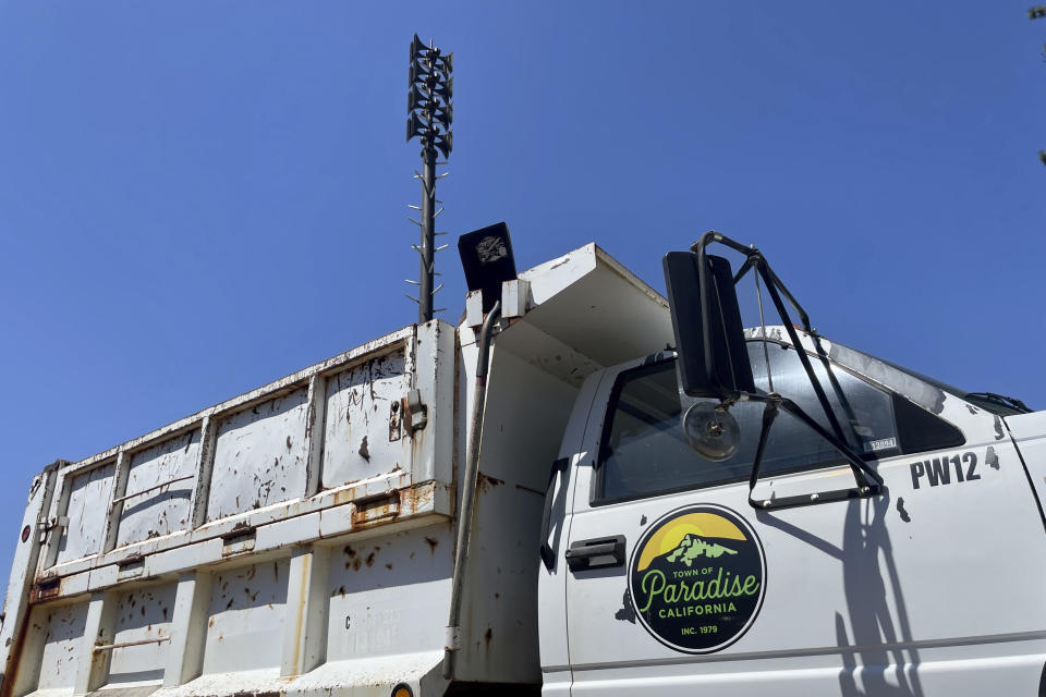 A new wildfire siren stands in Paradise, Calif., on Saturday, Aug. 5, 2023. Officials in Paradise began testing a new wildfire siren system this summer as the five-year anniversary of the deadly and devastating Camp Fire approaches. Reliable warning systems are becoming more critical during wildfires, especially as power lines and cell towers fail, knocking out communications critical to keeping people informed. (AP Photo/Haven Daley)