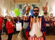 <p>Parry Casto, a fifth grade teacher at the Explorer Academy in Huntington, W.Va., dressed in an Uncle Sam costume leads hundreds of teachers in chants outside the state Senate chambers at the Capitol in Charleston, W. Va., on March 1, 2018. The strike rolled into its second weekend with the state Senate planning to meet Saturday, March 3 after declining to take a vote on whether the teachers will get the 5 percent pay raise negotiated by Gov. Jim Justice and union leaders. (Photo: John Raby/AP) </p>