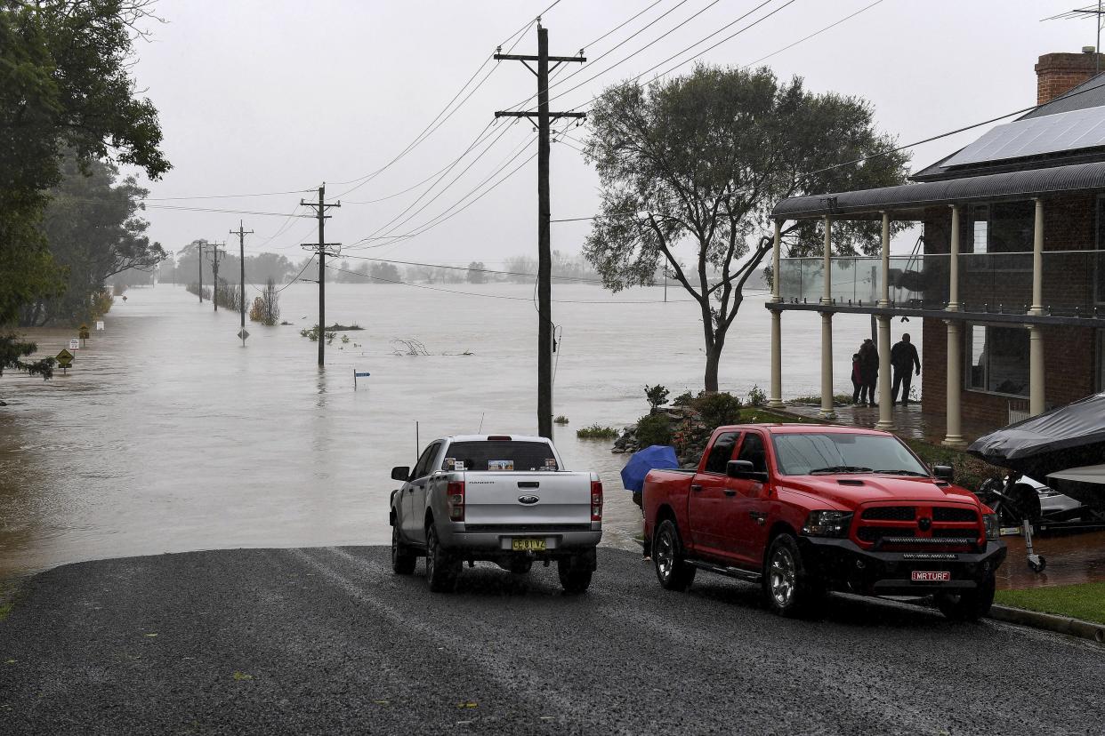 Residential properties and roads are submerged under floodwater from the swollen Hawkesbury River in Windsor, northwest of Sydney, Australia Monday, July 4, 2022.