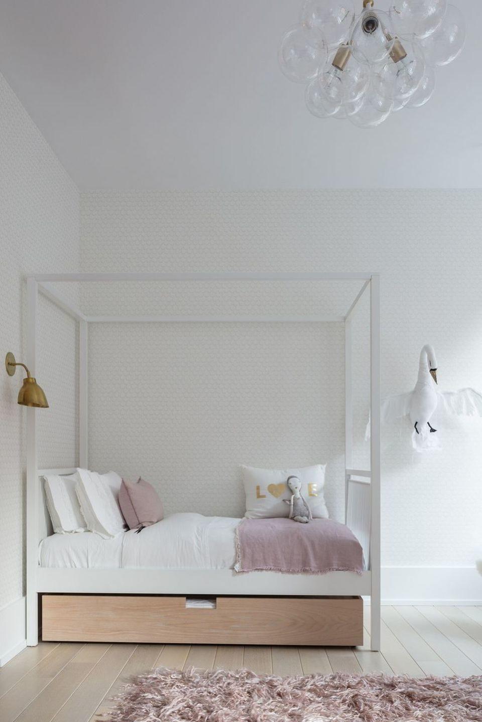 a bed with a white wall