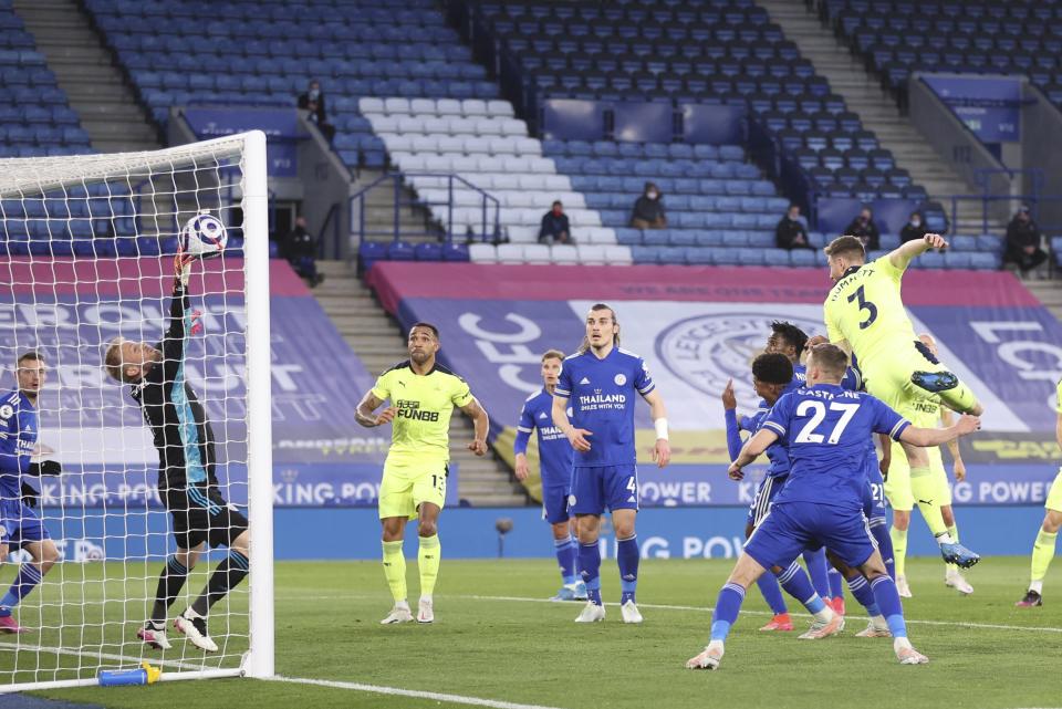 Newcastle's Paul Dummett, right, scores his team's second goal during the English Premier League soccer match between Leicester City and Newcastle United at the King Power Stadium in Leicester, England, Friday, May 7, 2021.(Alex Pantling/Pool via AP)