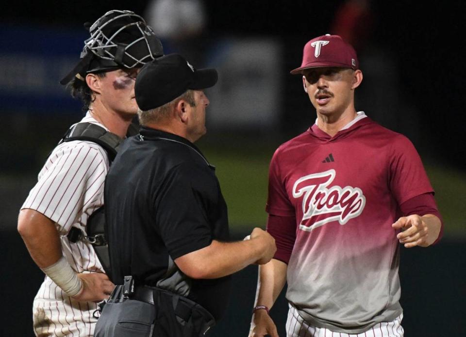 Troy head coach Skylar Meade makes a pitching change during the game with Alabama at Sewell-Thomas Stadium in Tuscaloosa, Ala., Saturday June 4, 2023, in the winners bracket game of the NCAA Regional Baseball Tournament.