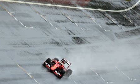 Ferrari Formula One driver Sebastian Vettel of Germany drives during the third practice session of the Austrian F1 Grand Prix at the Red Bull Ring circuit in Spielberg, Austria, June 20, 2015. REUTERS/Laszlo Balogh