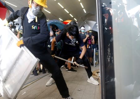 Protesters break into the Legislative Council building during the anniversary of Hong Kong's handover to China in Hong Kong