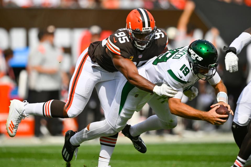 Browns defensive end Myles Garrett sacks New York Jets quarterback Joe Flacco during the first half, Sunday, Sept. 18, 2022, in Cleveland.