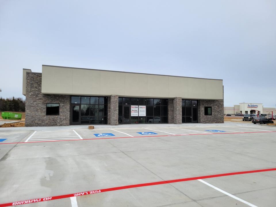 The three unit building located west of Scooter's Coffee at the Market Street Shopping Center will soon be the home of Qdoba Mexican Eats, Sport Clips and Jersey Mike's Subs.