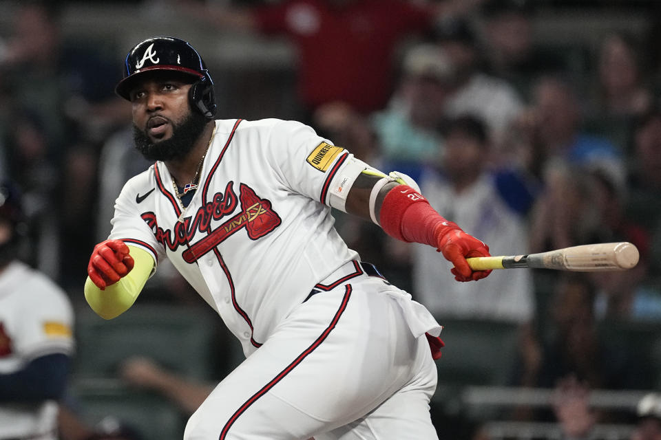 Atlanta Braves designated hitter Marcell Ozuna (20) hits a two-run double in the fifth inning of a baseball game against the Philadelphia Phillies Tuesday, Sept. 19, 2023. (AP Photo/John Bazemore)