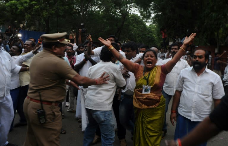 Indian supporters of Jayalalithaa Jayaram react outside the hospital where she was being treated in Chennai on December 5, 2016