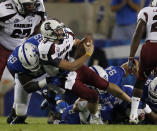 Connor Shaw #14 of the South Carolina Gamecocks is sacked by Donte Rumph #99 of the Kentucky Wildcats at Commonwealth Stadium on September 29, 2012 in Lexington, Kentucky. (Photo by John Sommers II/Getty Images)