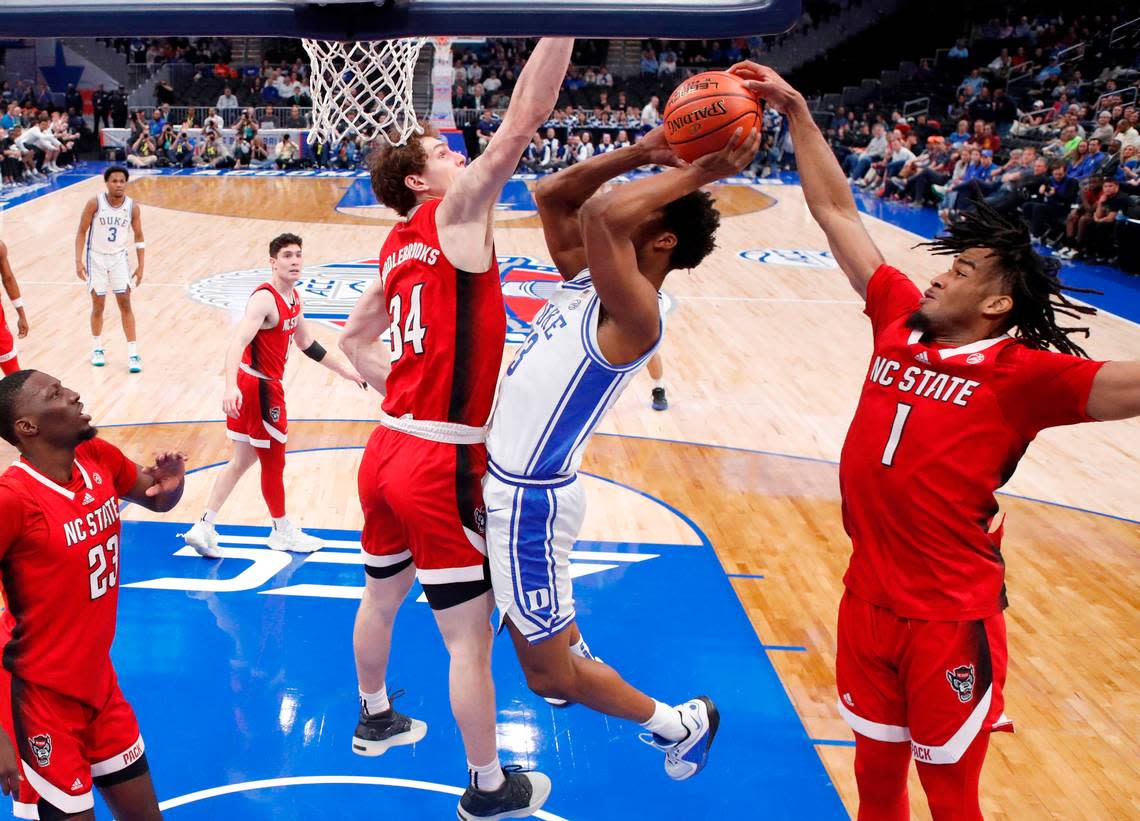 N.C. State’s Jayden Taylor (1) blocks the shot by Duke’s Sean Stewart (13) during N.C. State’s 74-69 victory over Duke in the quarterfinal round of the 2024 ACC Men’s Basketball Tournament at Capital One Arena in Washington, D.C., Thursday, March 14, 2024.