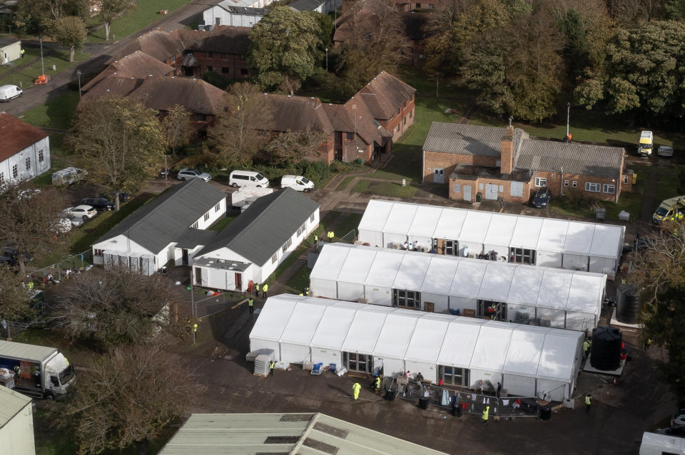 RAMSGATE, ENGLAND - NOVEMBER 01: An aerial view of families inside a migrant holding facility at Manston Airfield on November 01, 2022 in Ramsgate, England. Several thousand migrants are currently staying at this former Royal Air Force base, with hundreds moved here over the weekend after a petrol-bomb attack on a processing centre in Dover. (Photo by Dan Kitwood/Getty Images)