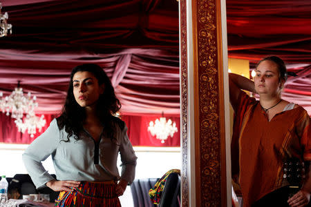 Actress Mihaela Dragan (L) and musician Elena Albu take part in a rehearsal for a poetry night in La Tiganci (At the Gypsies') restaurant, in Bucharest, Romania, March 6, 2016. REUTERS/Andreea Campeanu