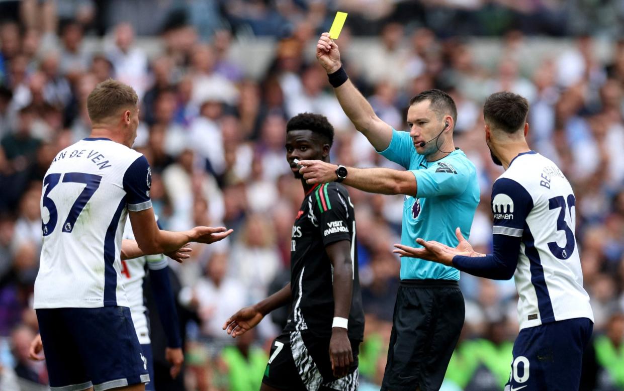 Micky van de Ven shown a yellow card