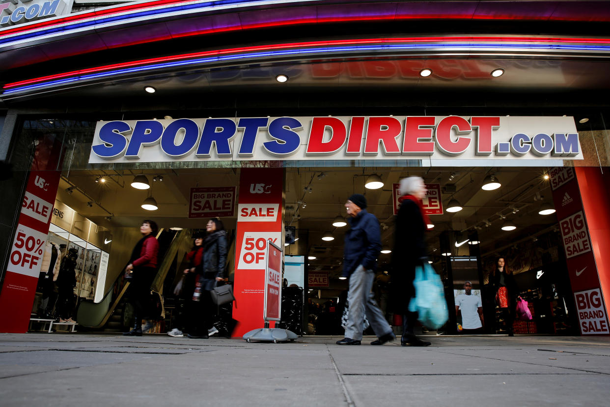 Shoppers walk past Sports Direct store on Oxford Street in London, Britain December 17, 2018. REUTERS/Simon Dawson