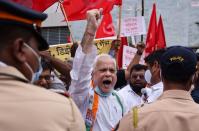 Members of the Indian National Congress (INC) political party protest against farm laws during a nationwide strike, in Mumbai