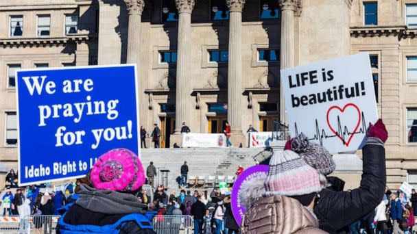 PHOTO: Demonstrators walk to the Idaho Capitol carrying anti-abortion signs for the Boise March for Life rally in 2023. (Idaho Statesman/Tribune News Service via Getty Images)