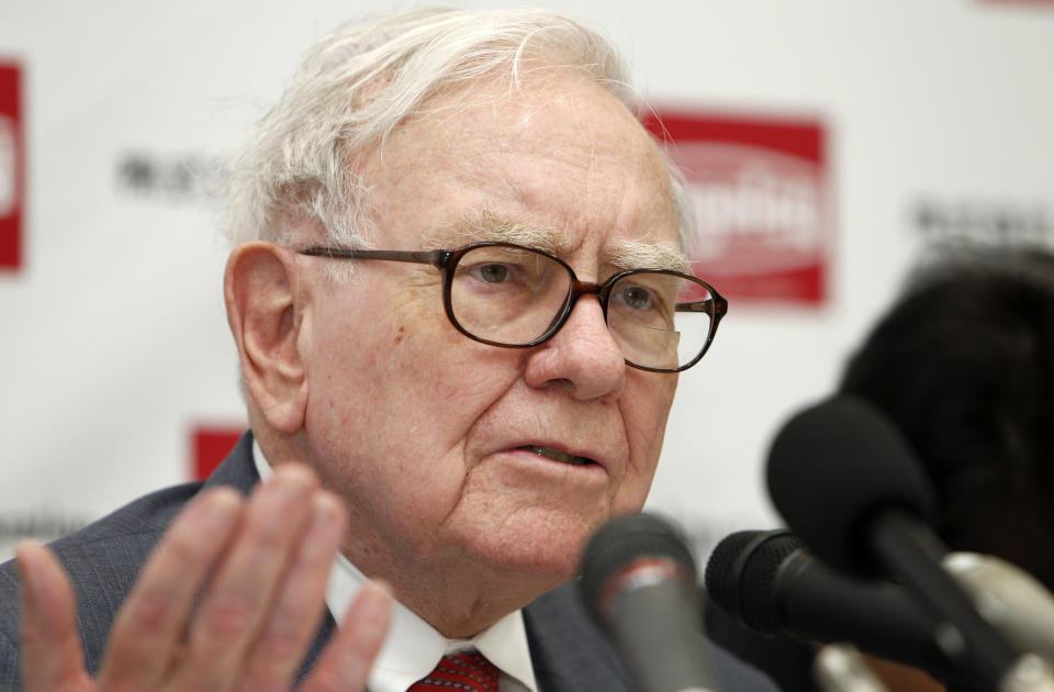 FILE - In this Nov. 21, 2011 file photo, U.S. billionaire investor Warren Buffett, chairman and CEO of Berkshire Hathaway, speaks during a news conference at the headquarters of cemented carbide tool supplier Tungaloy Corporation after inaugurating its new factory in Iwaki city, Fukushima prefecture, northern Japan. Buffett said Wednesday, Nov. 30, 2011, Berkshire Hathaway is buying the Omaha World-Herald Co. and expanding the firm&#39;s newspaper holdings despite Buffett&#39;s misgivings about the industry. (AP Photo/Shuji Kajiyama, File)