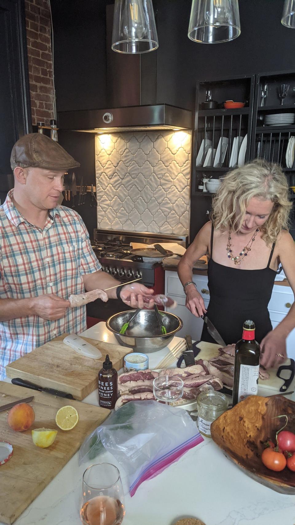 Chef Aaron Schorsch gives Courier Journal food writer Dana McMahan a lesson in French cooking at her home in Old Louisville.