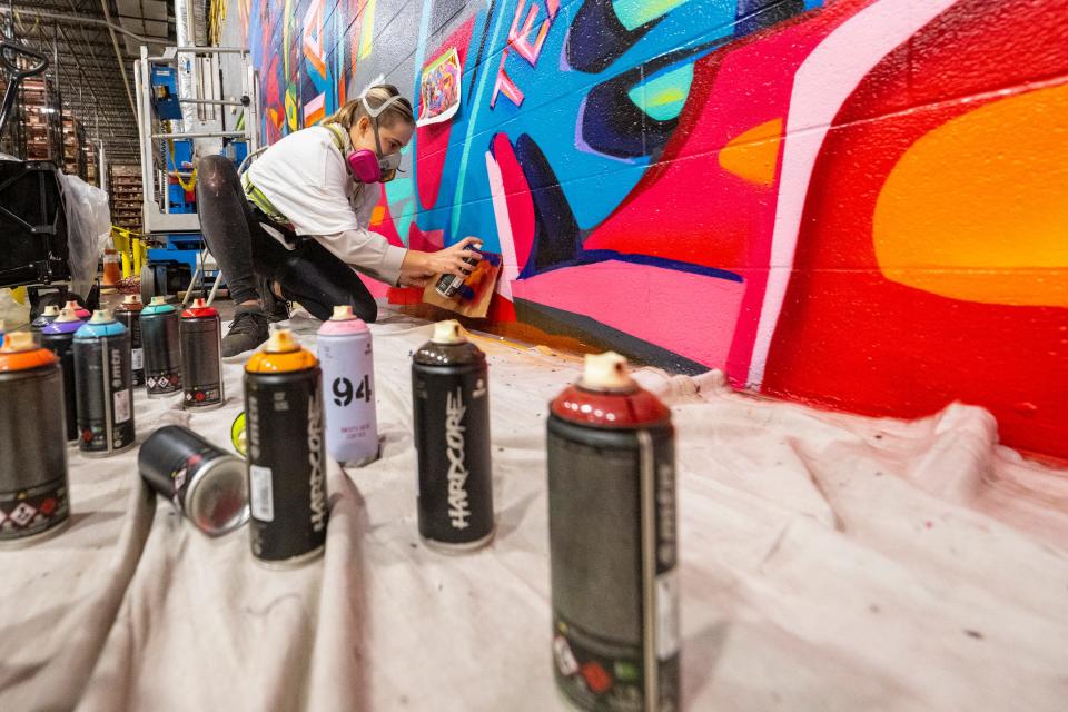 Koda Witsken is a much-in-demand muralist with clients across Central Indiana and the country. On Monday, Feb. 6, 2023, she was working on the last phase of a project at a Target Distribution Center in Indianapolis.