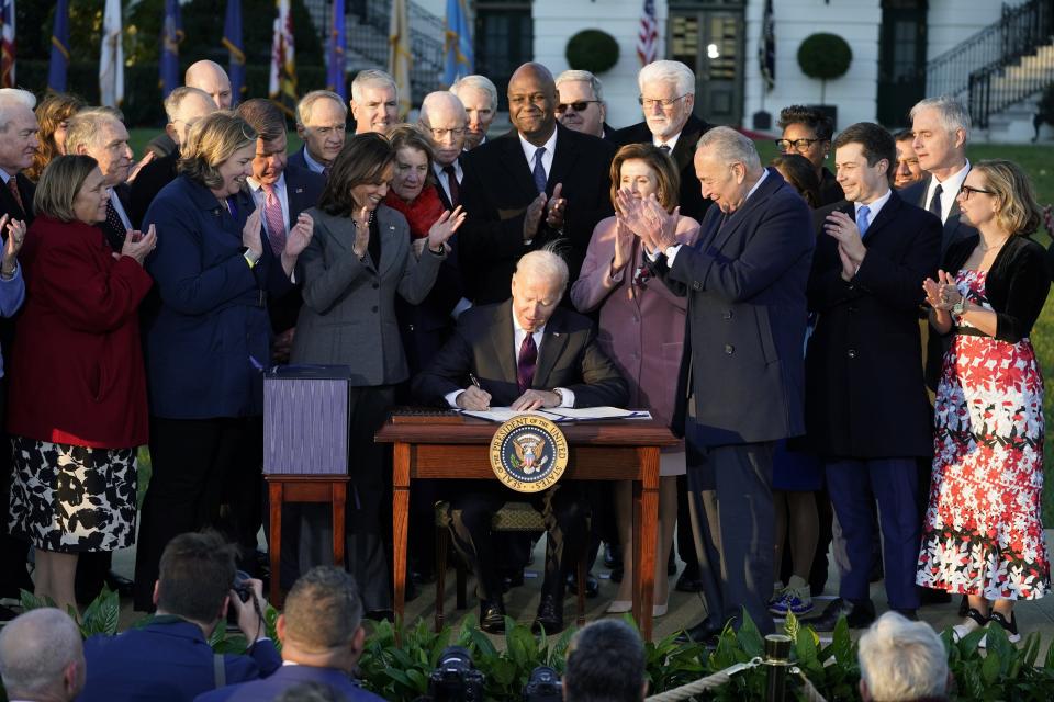 President Joe Biden signs the "Infrastructure Investment and Jobs Act" during an event on the South Lawn of the White House, Monday, Nov. 15, 2021, in Washington. (AP Photo/Evan Vucci)