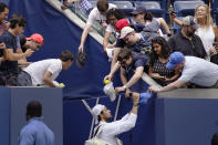 Matteo Berrettini, of Italy, signs autographs for fans after defeating Alejandro Davidovich Fokina, of Spain, during the fourth round of the U.S. Open tennis championships, Sunday, Sept. 4, 2022, in New York. (AP Photo/Julia Nikhinson)