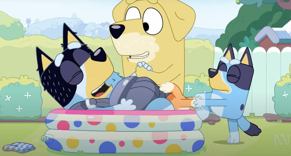 Scene from Bluey showing dad Bandit simulating giving birth