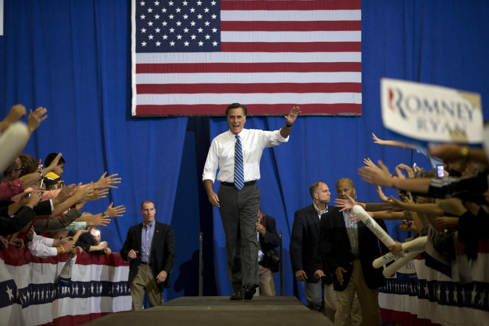 Republican presidential candidate, former Massachusetts Gov. Mitt Romney waves as he arrives for a campaign rally at the U.S. Cellular Center on Thursday, Oct. 11, 2012 in Asheville, N.C. (AP Photo/ Evan Vucci)