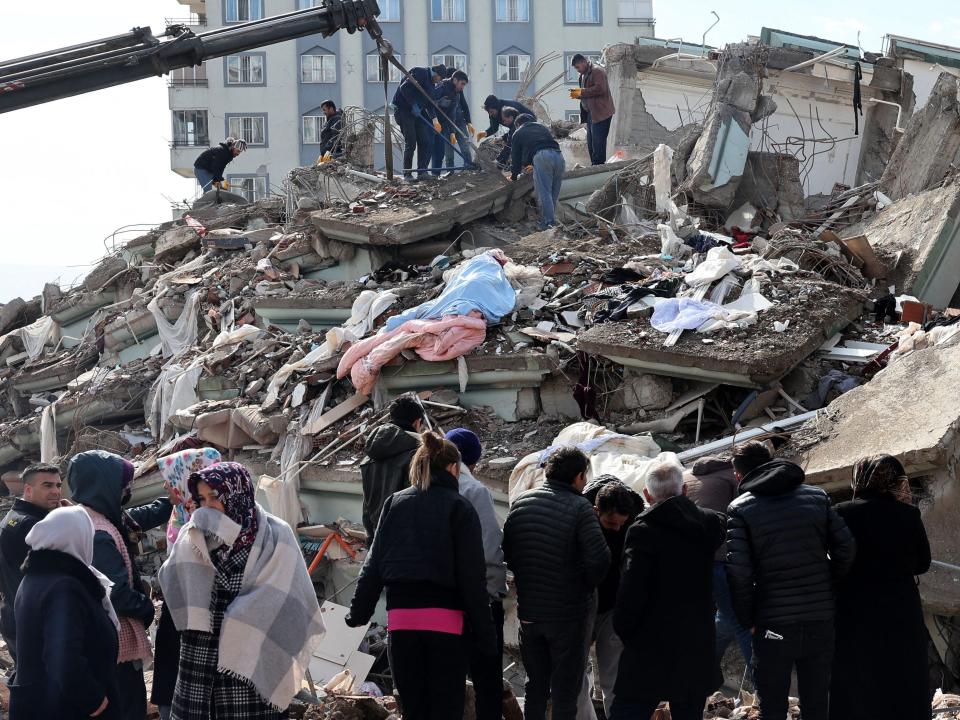 Rescuers and civilians look for survivors under the rubble of collapsed buildings in Kahramanmaras, Turkey. A 7.8-magnitude earthquake struck the country's southeast on February 7, 2023.