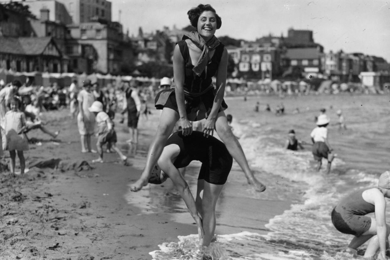 Two women playing leapfrog on the beach at Broadstairs in Kent in 1927: Getty Images