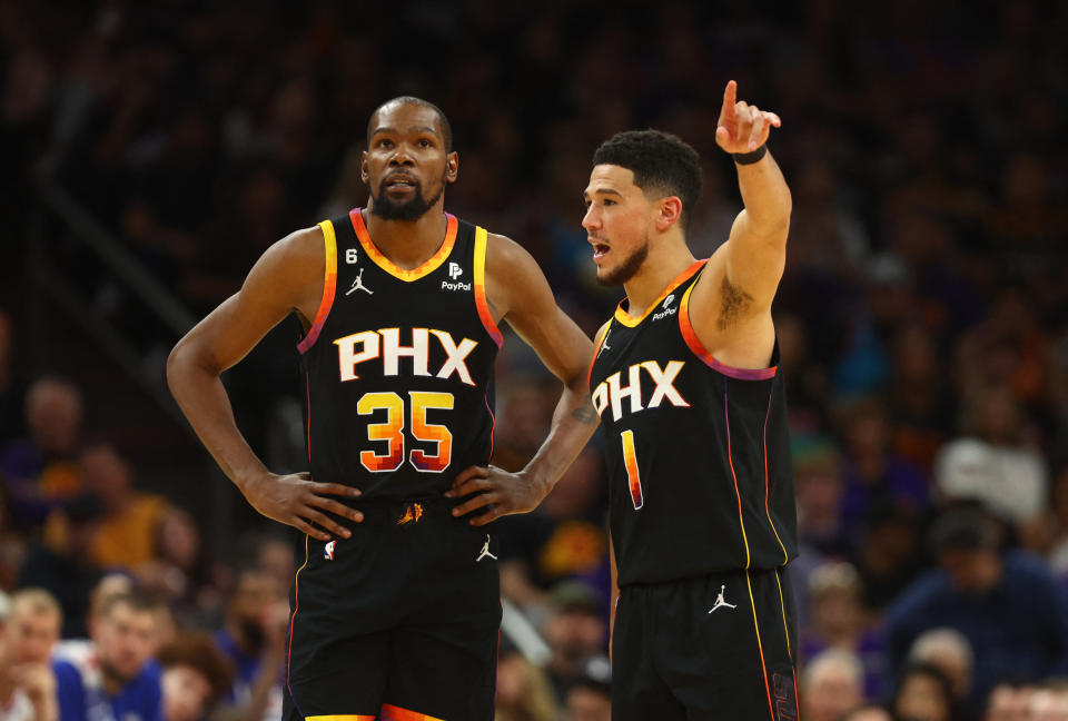 Phoenix Suns guard Devin Booker and forward Kevin Durant during a break in play against the Los Angeles Clippers of Game 2 in their first-round NBA playoffs series at Footprint Center in Phoenix. (Mark J. Rebilas/USA TODAY Sports)