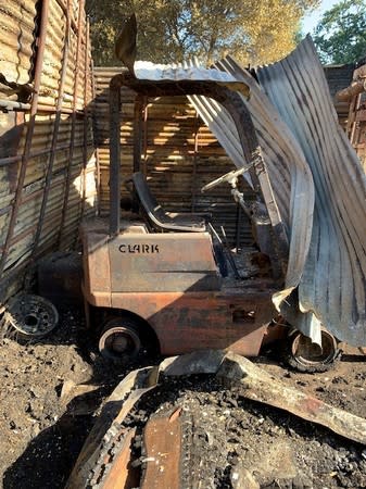 A forklift destroyed by the Sand Fire is seen in the Capay Valley in California