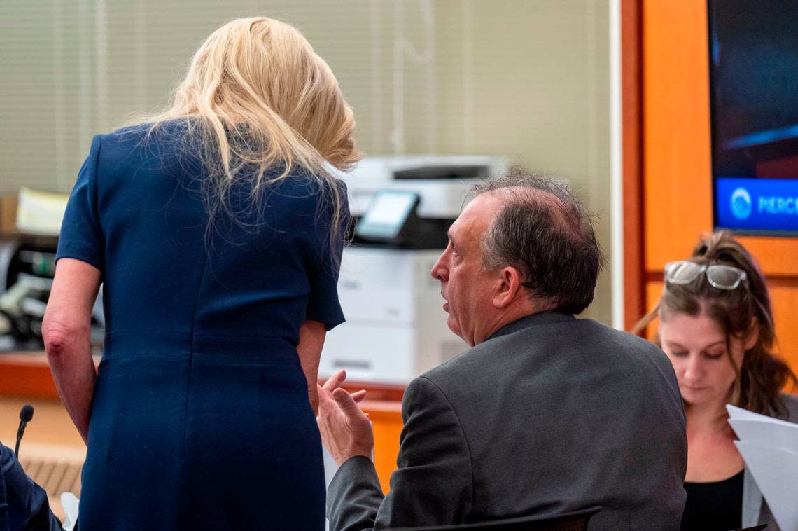 Pierce County Sheriff Ed Troyer talks with his defense attorney Anne Bremner during the testimony of Sedrick Altheimer on Tuesday, Dec. 6, 2022, in Pierce County District Court in Tacoma.