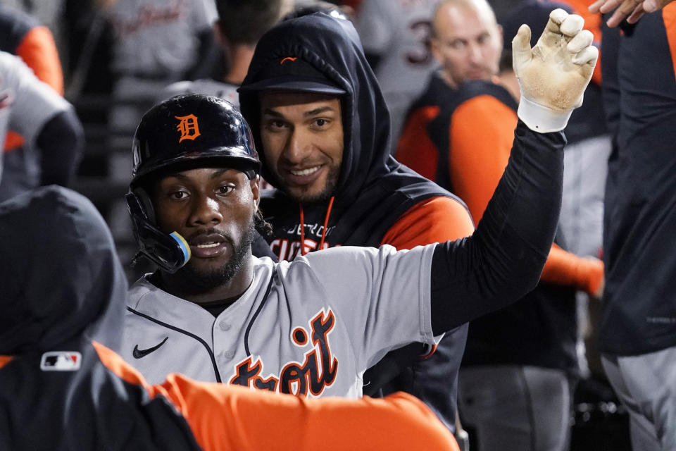 Detroit Tigers' Akil Baddoo celebrates with teammates after scoring on a sacrifice fly by Riley Greene during the seventh inning of a baseball game against the Chicago White Sox in Chicago, Friday, Sept. 23, 2022. (AP Photo/Nam Y. Huh)