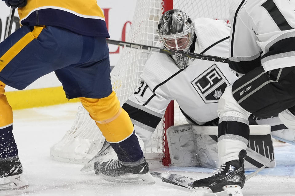 Los Angeles Kings goaltender David Rittich (31) defends the goal during the second period of an NHL hockey game against the Nashville Predators, Wednesday, Jan. 31, 2024, in Nashville, Tenn. (AP Photo/George Walker IV)