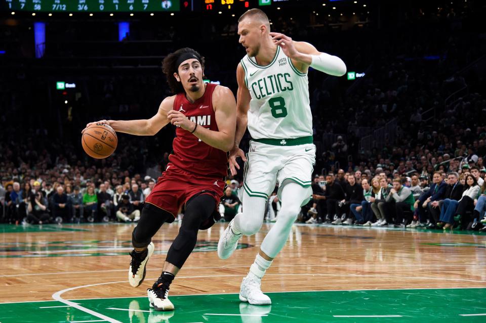 The Heat's Jaime Jaquez Jr., a Camarillo High graduate, tries to drive past the Celtics' Kristaps Porzingis during Game 1 of an Eastern Conference first-round series on Sunday, April 21, 2024.