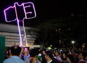 A WP supporter creates a giant hammer out of flickering decorative lights for the Bedok rally. (Yahoo! photo/ Terence Lee)