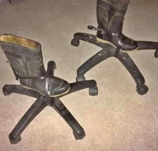 boots taped onto the wheels of office chairs