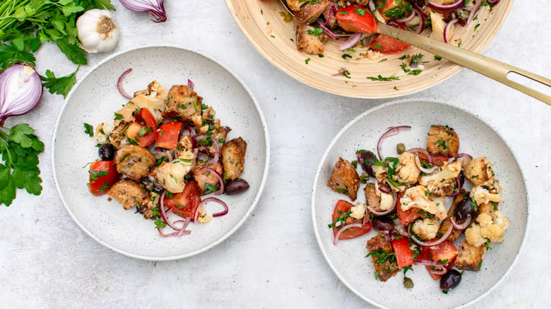 two plate of roasted cauliflower panzanella salad