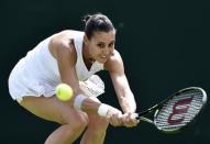 Flavia Pennetta of Italy hits the ball during her match against Zarina Diya of Kazakhstan at the Wimbledon Tennis Championships in London, June 29, 2015. REUTERS/Toby Melville