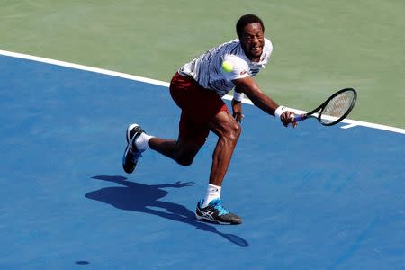 Jul 24, 2016; Washington, DC, USA; Gael Monfils of France reaches for a backhand against Ivo Karlovic of Croatia (not pictured) in the men's singles final of the Citi Open at Rock Creek Park Tennis Center. Monfils won 5-7, 7-6(6), 6-4. Mandatory Credit: Geoff Burke-USA TODAY Sports
