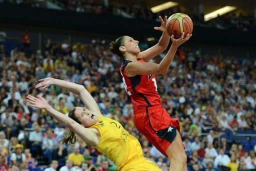 US guard Diana Taurasi jumps over Australian guard Belinda Snell during the London 2012 Olympic Games women's semifinal basketball match. Four-time defending champion United States advanced to the Olympic women's basketball final with an 86-73 victory over Australia on Thursday, stretching the US Olympic win streak to 40 games