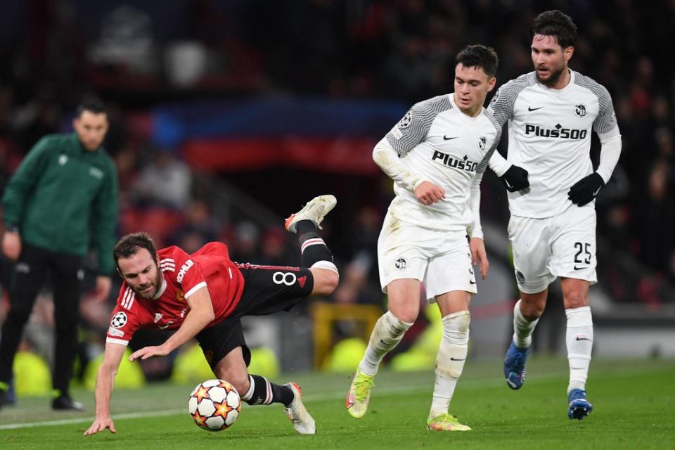 Juan Mata gets stuck in during the first half (AFP via Getty Images)