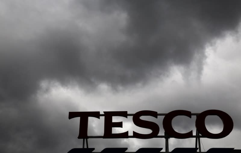 Grey clouds hang over a Tesco Extra store in New Malden in southwest London, Britain June 4, 2014. REUTERS/Luke MacGregor/File Photo