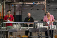 Allegheny County elections workers open and begin to process provisional ballots that were not challenged by campaign representatives, Monday, May 23, 2022, on the North Side neighborhood of Pittsburgh. (Alexandra Wimley