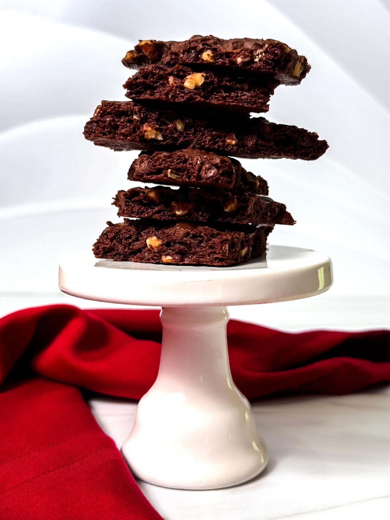 Unlike traditional brownies, which are dense and fudgy, brownie brittle is baked to a delicate crispness.