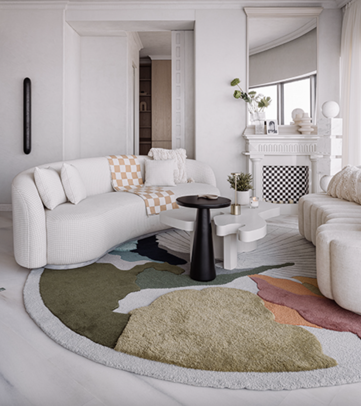  Neutral living room with bold rug. 