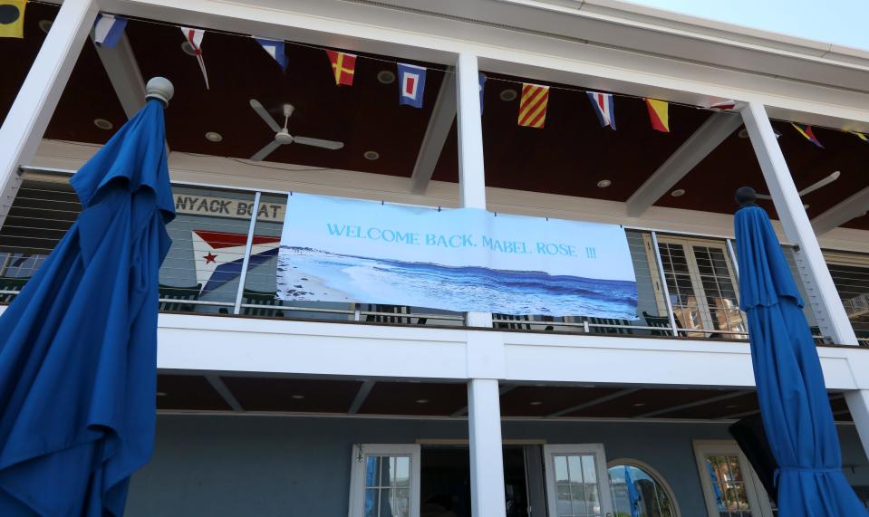 A banner at the Nyack Boat Club welcomes back Robin Bell and Karl Coplan who had just returned from sailing the Mabel Rose around the world May 7, 2024.